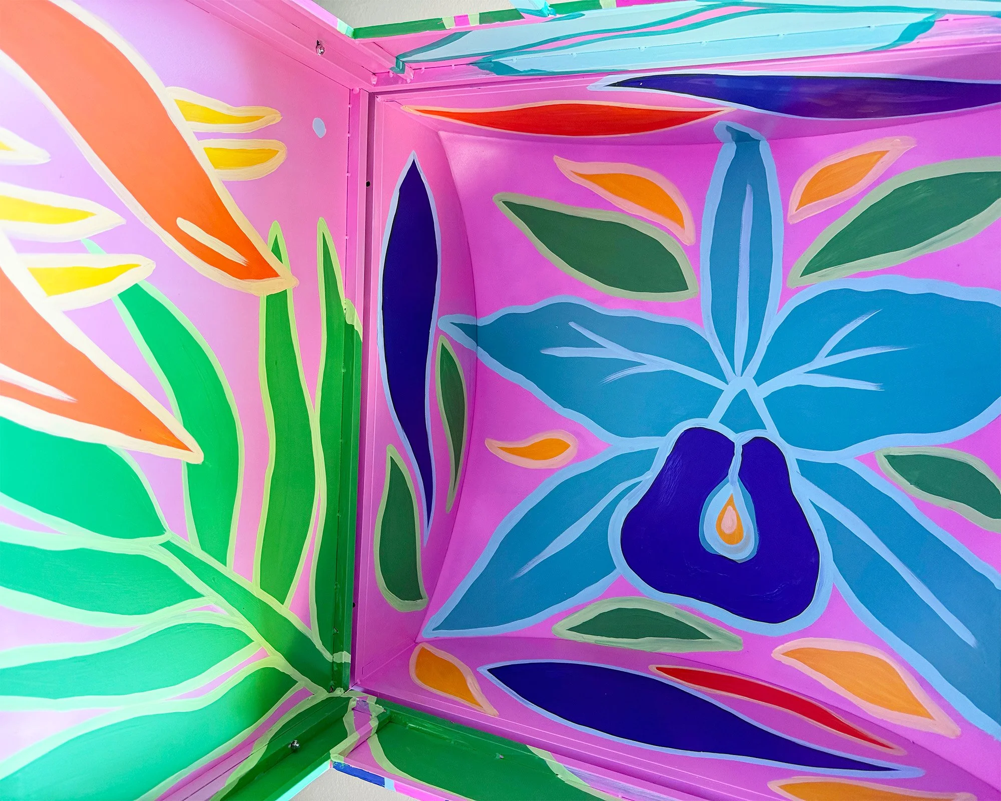 Close up detail of tropical leaves and colour transitions in a photo booth mural