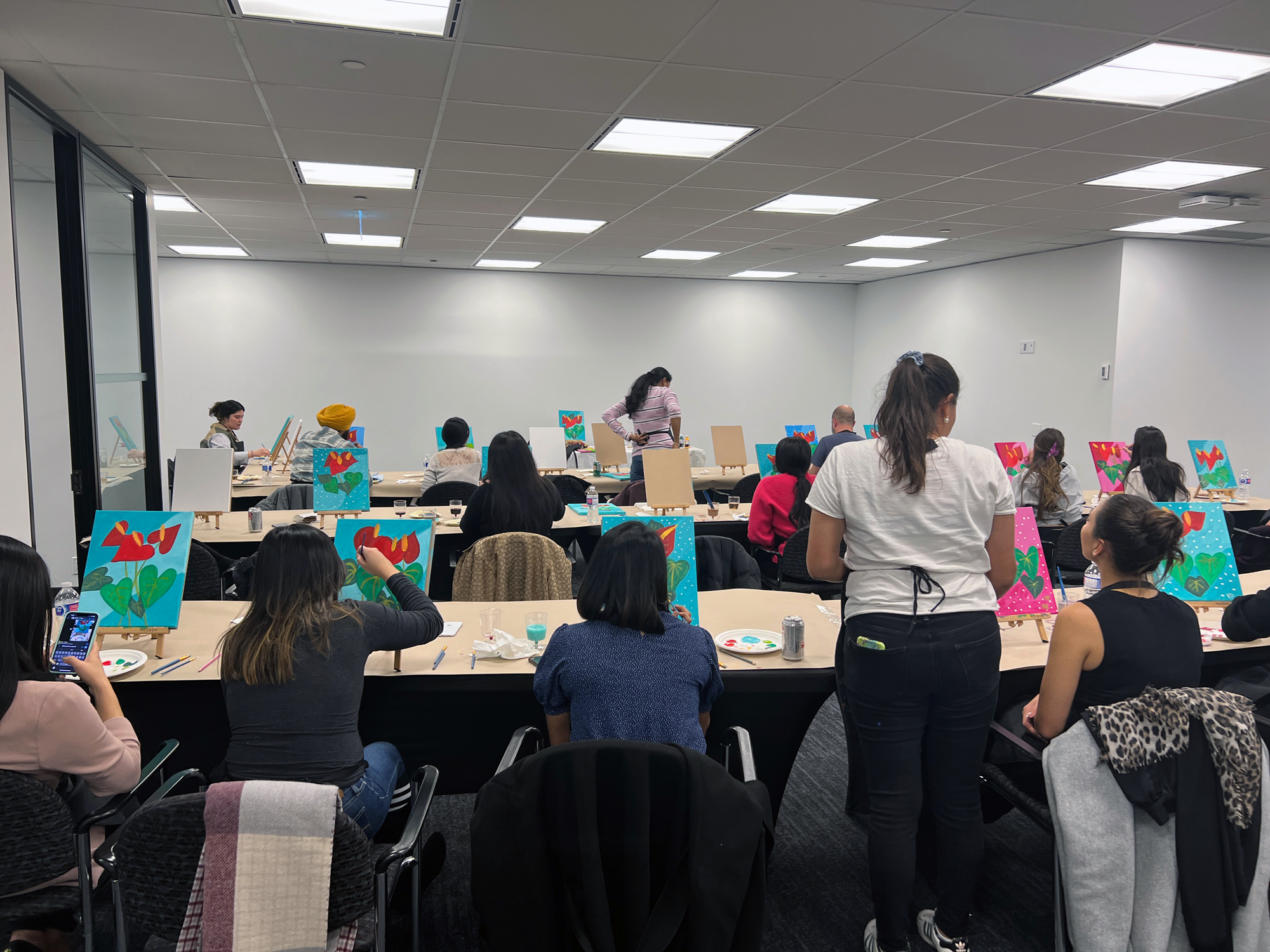 Participants making colourful artwork during a creative art workshop in Toronto led by AndreaCataRo.