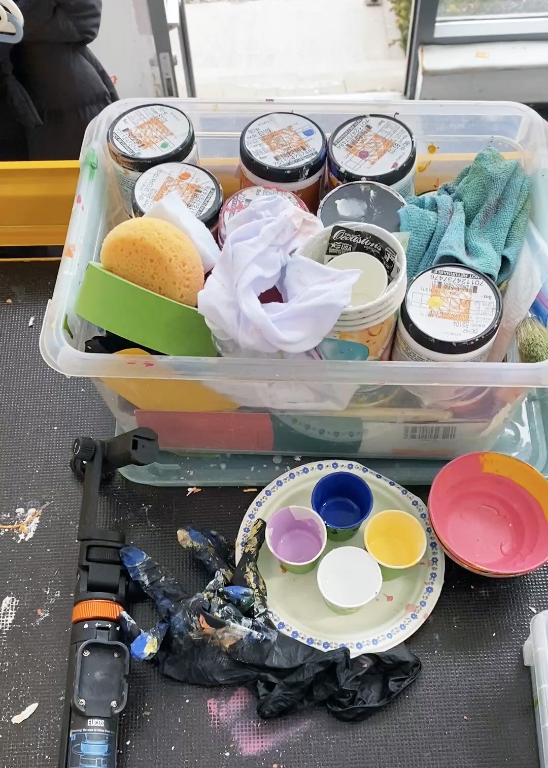 Mural project preparation showing paints, tools, and materials used before painting begins