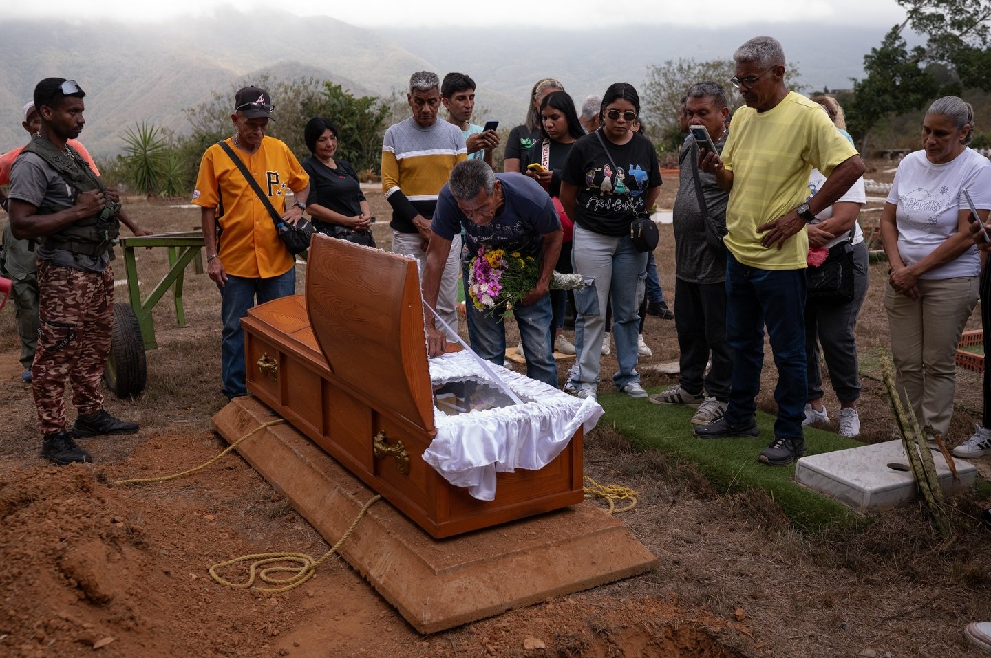 Relatives and loved ones held a funeral for Rosa Gonzalez, an 80-year-old woman who died in the aftermath of a U.S. military operation in Venezuela. She had been living in a family apartment in La Guaira state with her nephews when the building was h