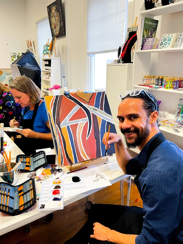 Artist painting at a Lyne Tilt studio workshop