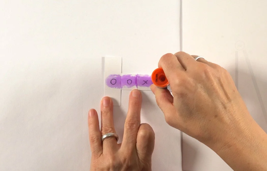 Place glue stick along the center of the T.