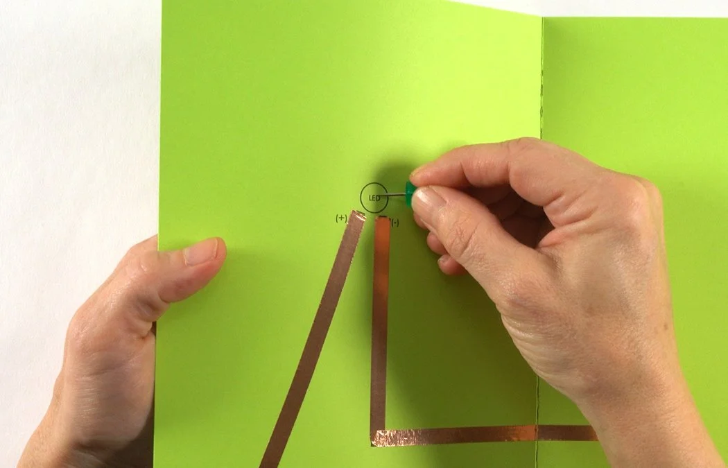 Poke a hole in your card where it says "LED". You can use a thumb tack or needle.