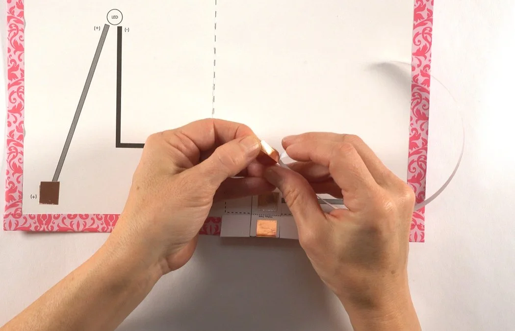Get a strip of the thinner 1/4" copper tape.