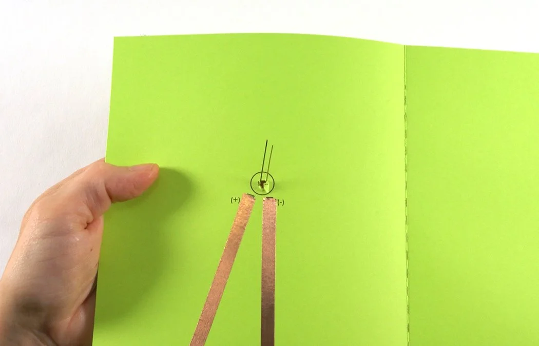 Twist the leads until the longer (+) wire faces the (+) side of your circuit.