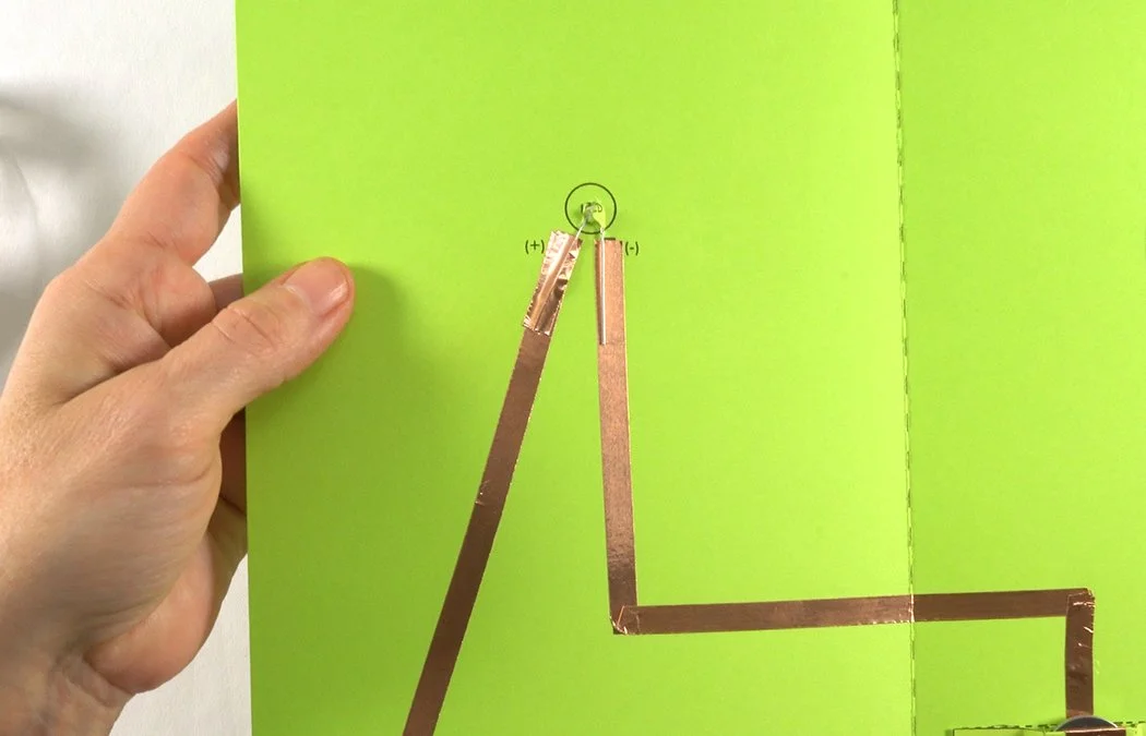 Stick the copper directly over one wire.