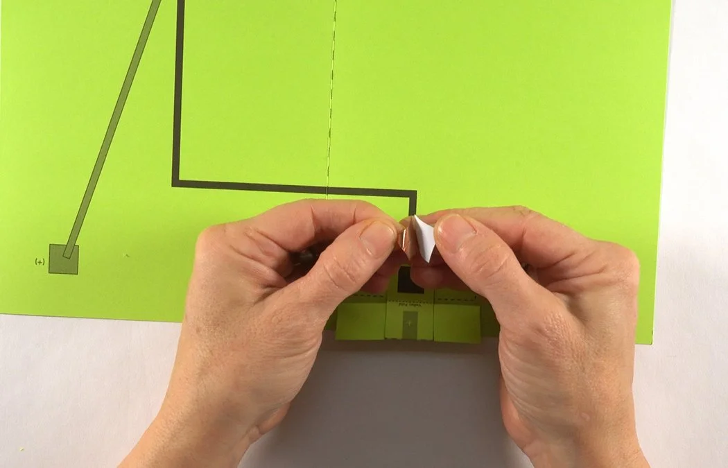 Cut (3) 1/2" x 1/2" copper tape squares. Remove the backing of one.