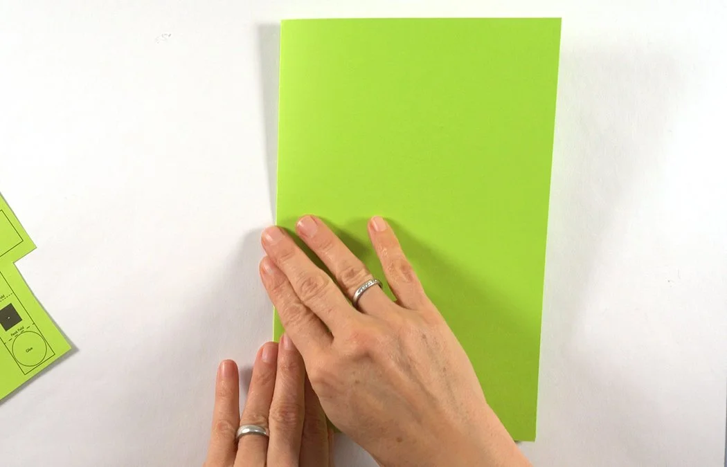 Smooth your fold. You can decorate your card with scrapbook paper, see the instructions for the Complex Version for details.