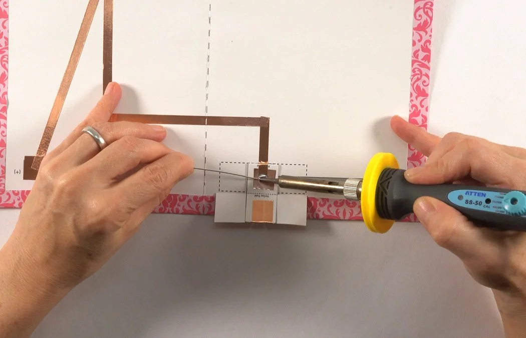 Follow this slideshow to add tech with soldering. Solder where the copper overlaps inside the battery box.