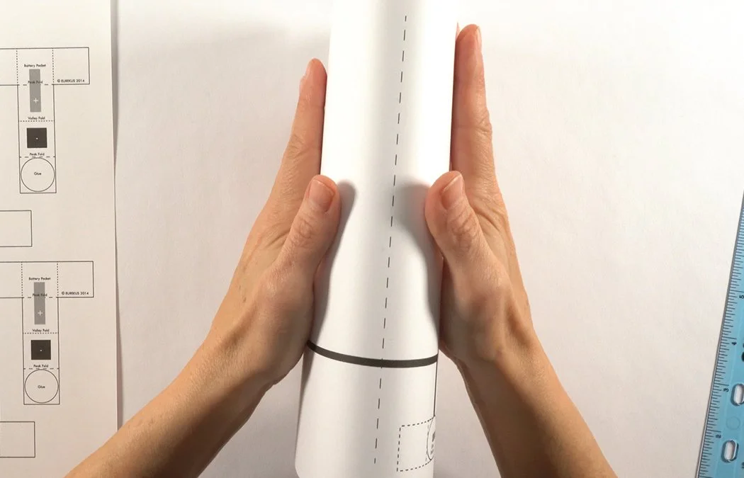 Fold the card in half looking at the diagrams.
