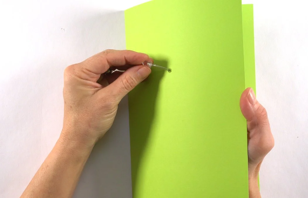 Insert the LED wires into the card from the front blank side.