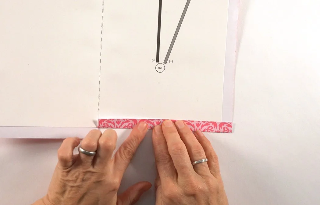 Fold the paper over to make a tab.