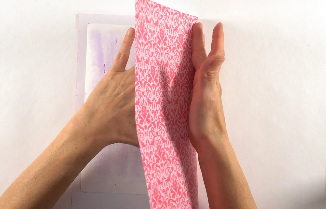 Fold the paper over to stick to the back side. This technique will prevent getting lumps in your paper at the fold.