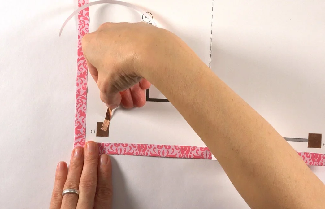 Stick the copper over the left copper switch pad. Make sure the copper overlaps.