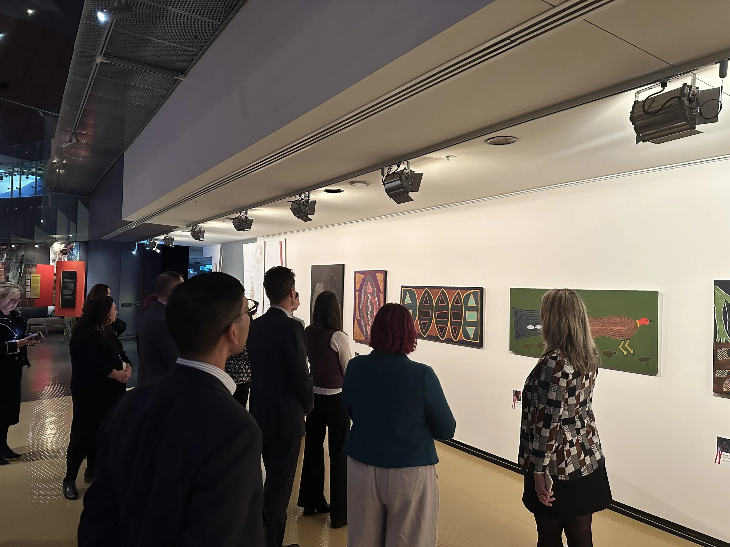  ASFI members attending a guided tour of the National Museum’s  Belonging  exhibition 