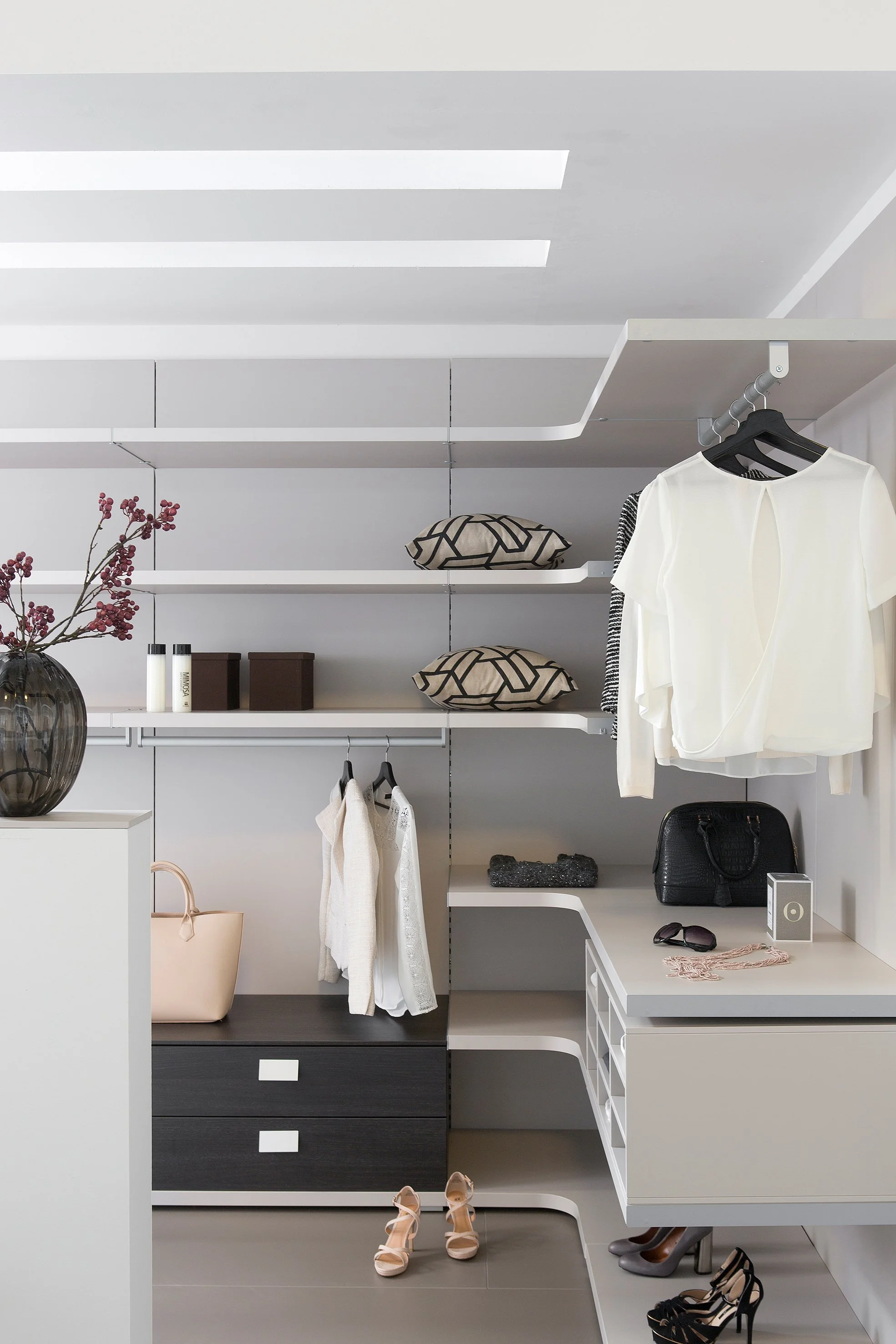 open wadrobe, stylish and organised. Showing off clothes and homewares. In hove, brighon , sussex.