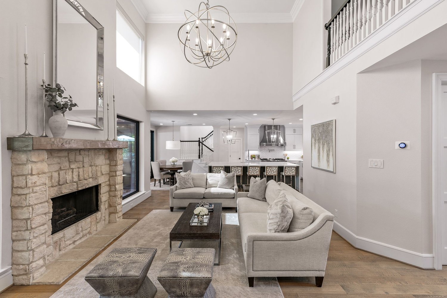 Two-story living room with stone fireplace
