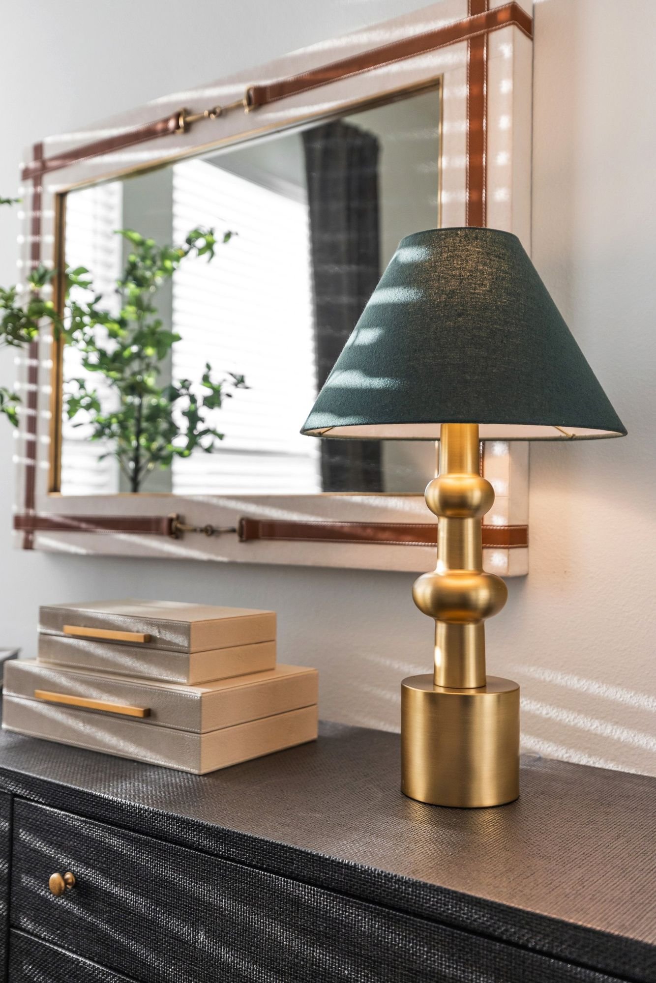 Styled vignette with brass lamp