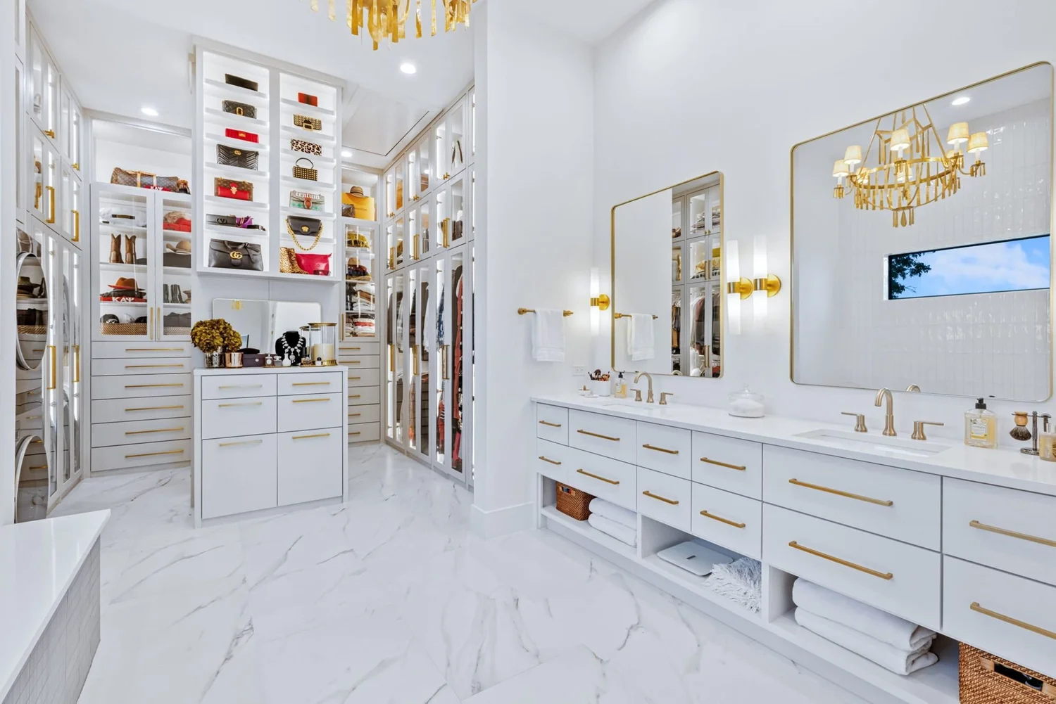 Lake house primary bath with brass mirrors and closet