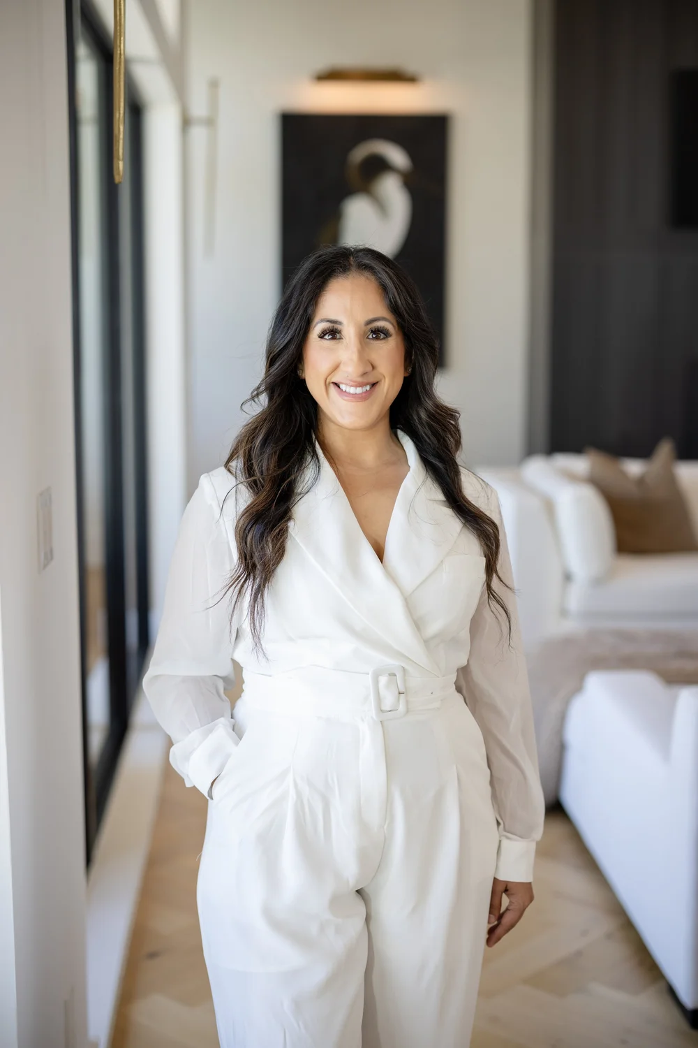 Woman in a white outfit smiling