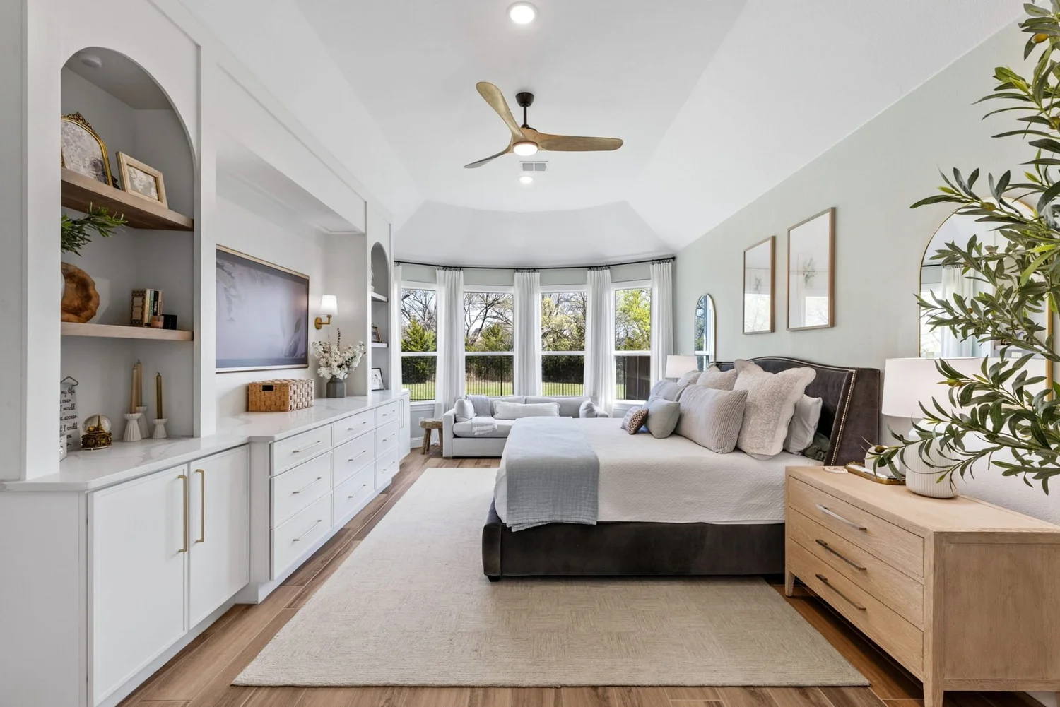 New construction primary bedroom with built-ins