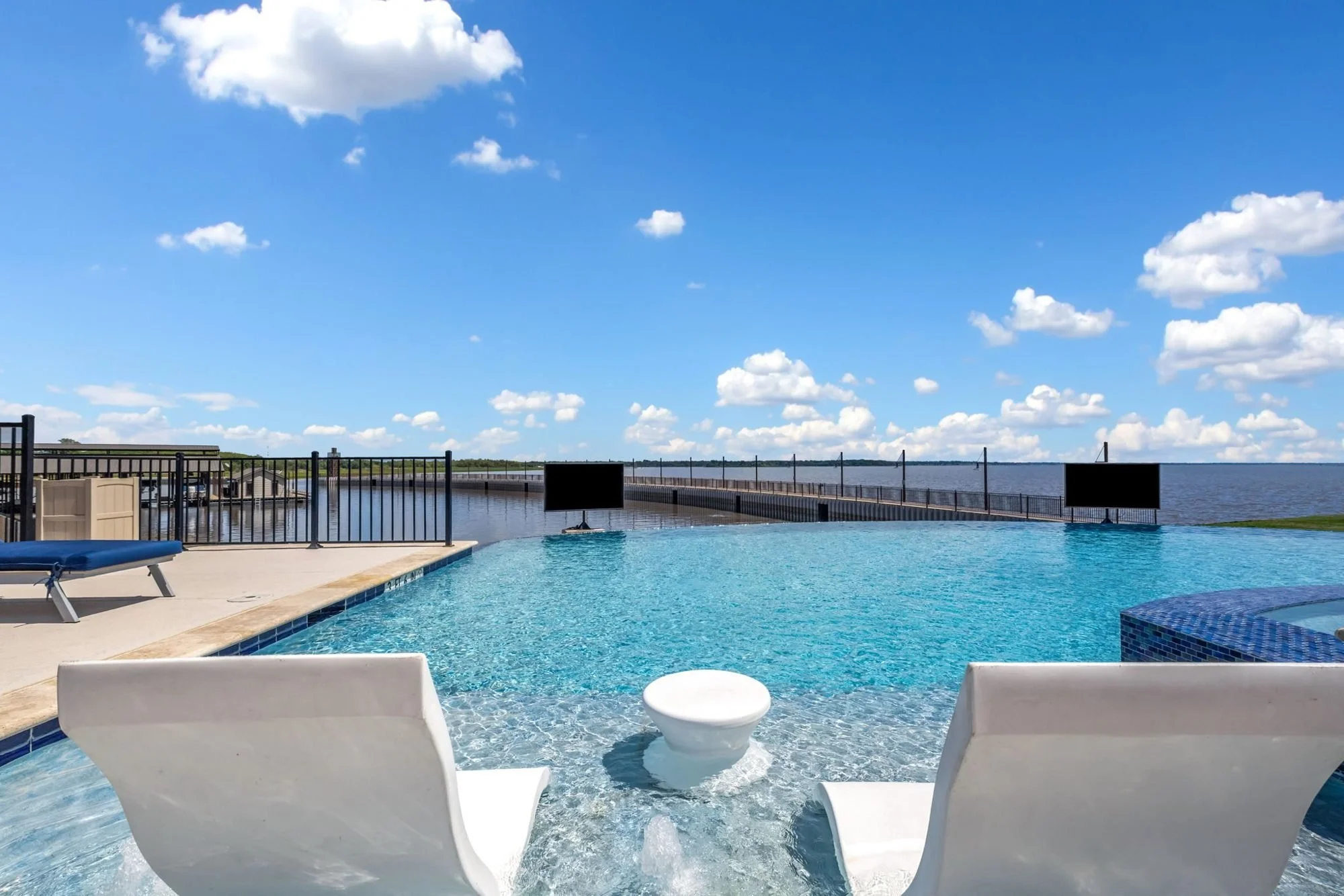 Lake house infinity pool overlooking the lake