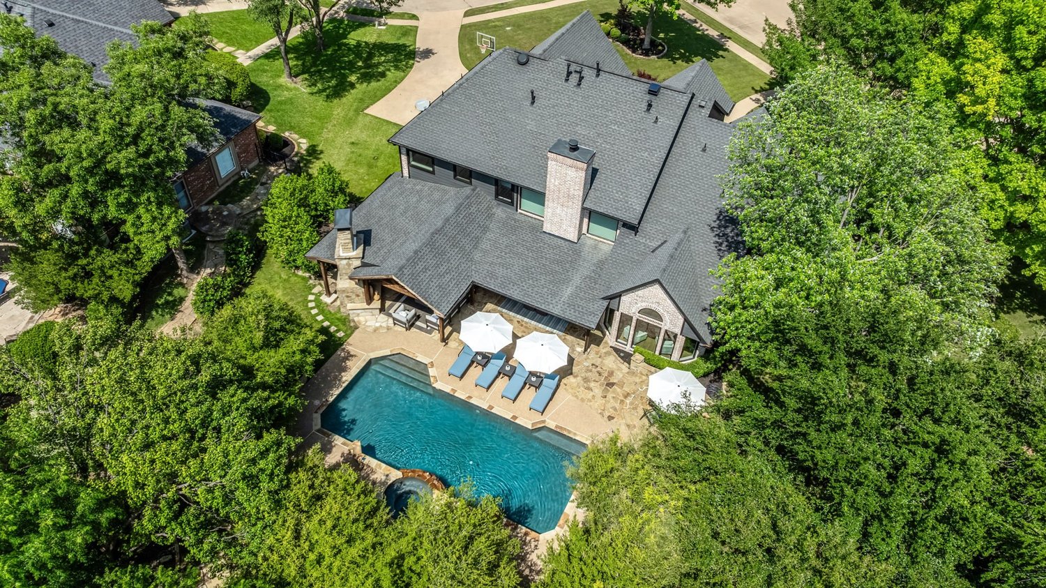 Aerial view of the home and pool