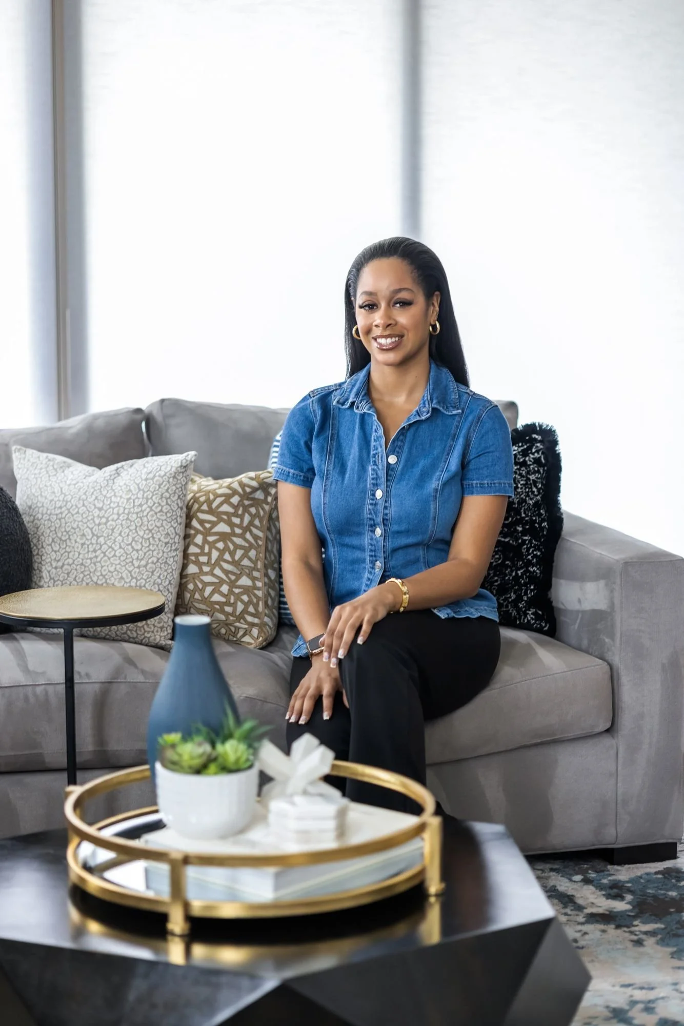 Interior designer seated in her finished living room