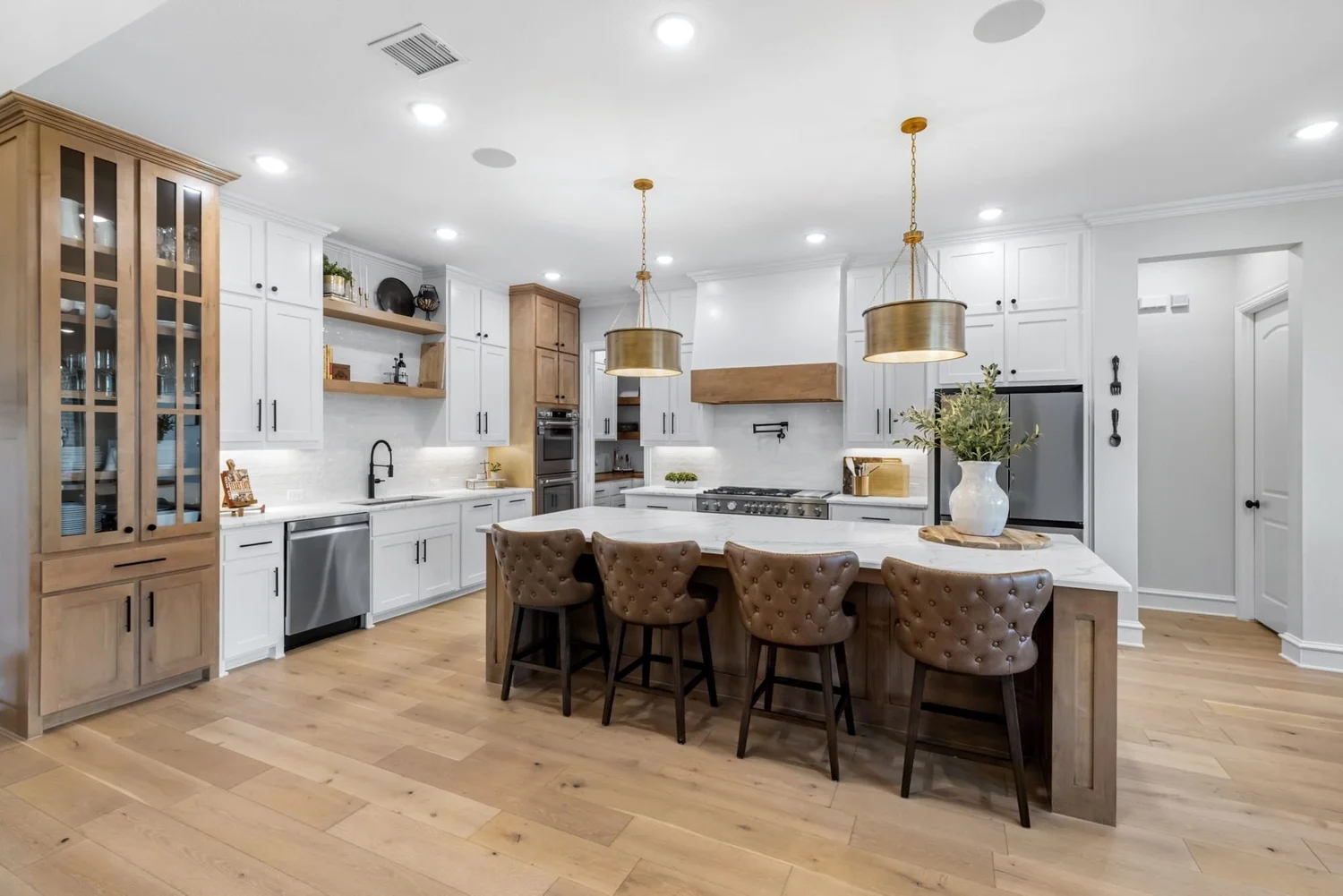 Custom home kitchen with wood cabinetry and island