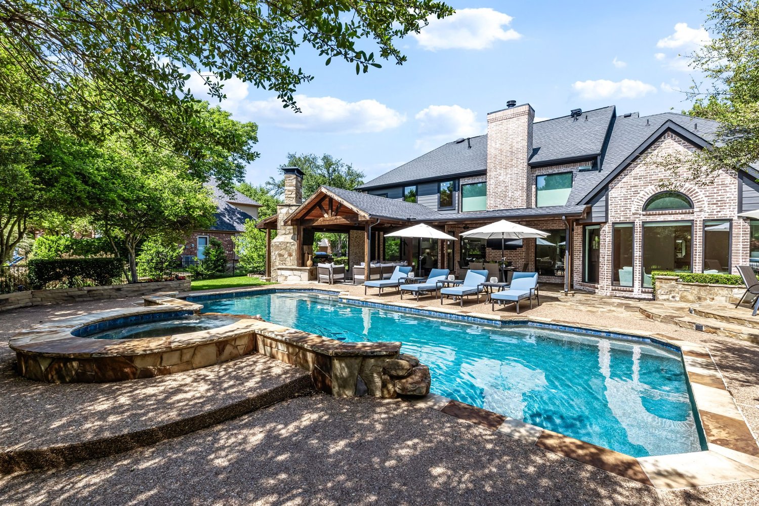 Backyard pool and stone patio