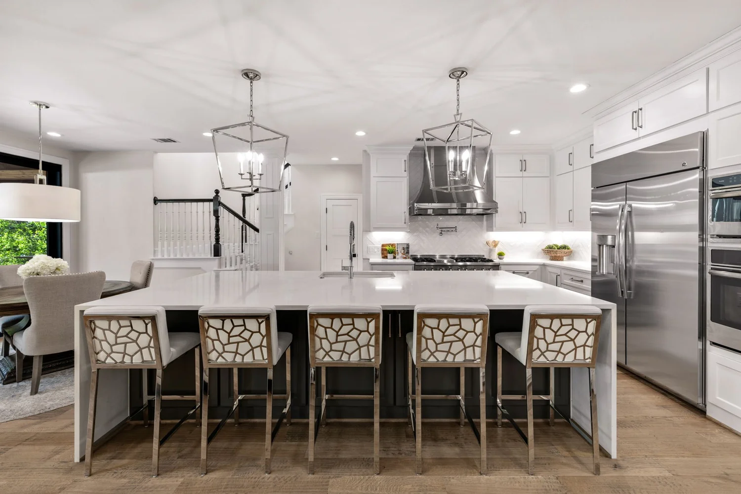 White kitchen with a large waterfall island