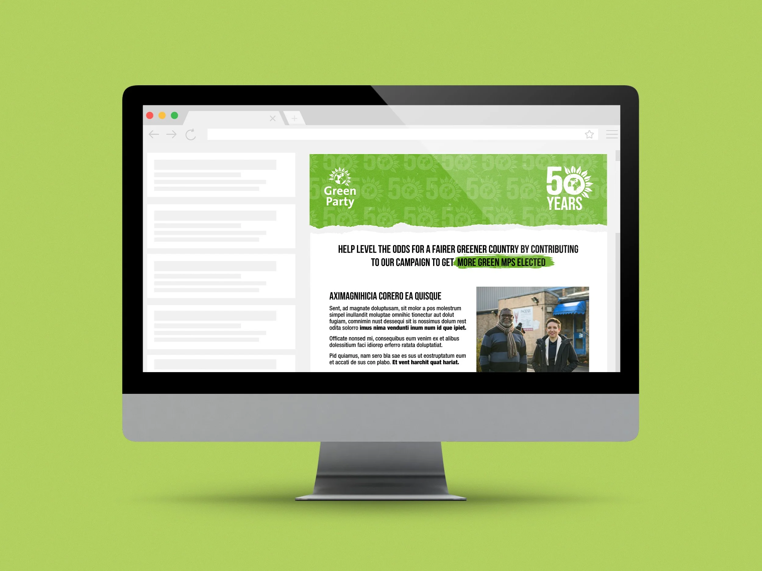 A computer monitor displaying an email with a green banner celebrating 50 years of the Green Party, featuring a logo and a photo of three people walking outdoors.