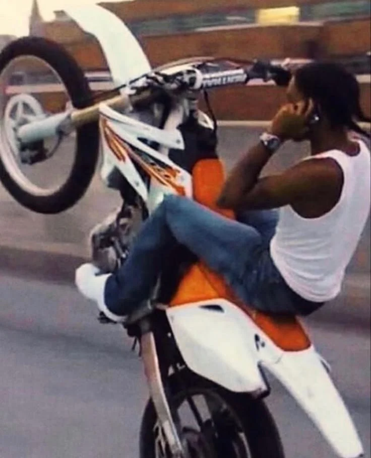 on phone wheelie.jpeg