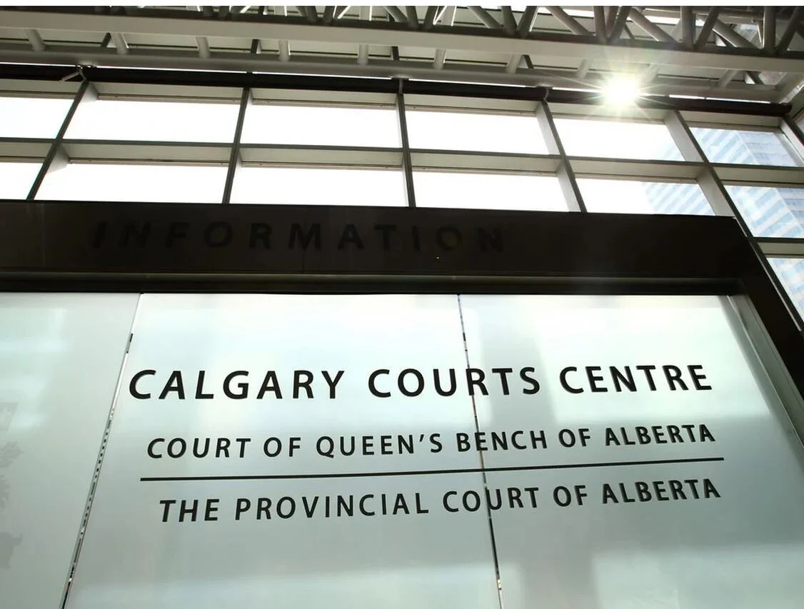 Crown downgrades charge against woman accused in the death of her domestic partner