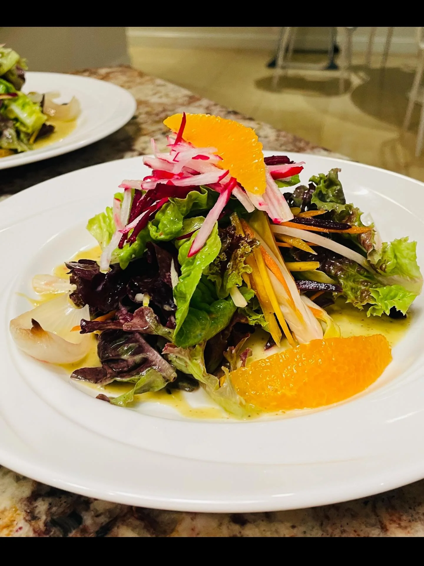 Fresh from the heart of Upcountry, this Maui healthy Kula green salad is a celebration of local flavor and freshness. Featuring tender organic greens grown in the cool climate of Kula, the salad is topped with crisp shaved root vegetables and vibrant
