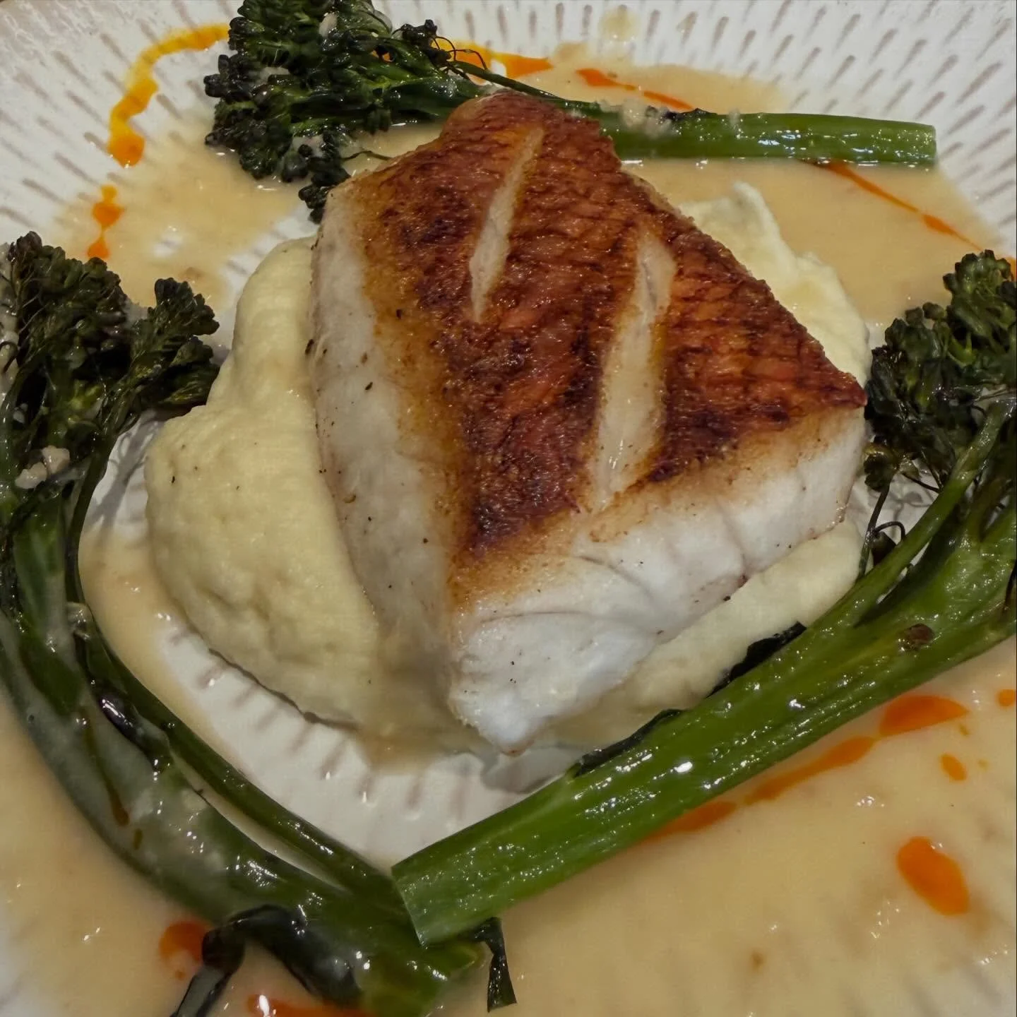 Crispy skin Onaga, pan-seared to golden perfection, served over silky parsnip celery root pur&eacute;e with charred broccolini and finished with a rich, buttery sauce and a touch of chili oil for warmth and balance. 
#CrispySkinOnaga #HawaiianSeafood