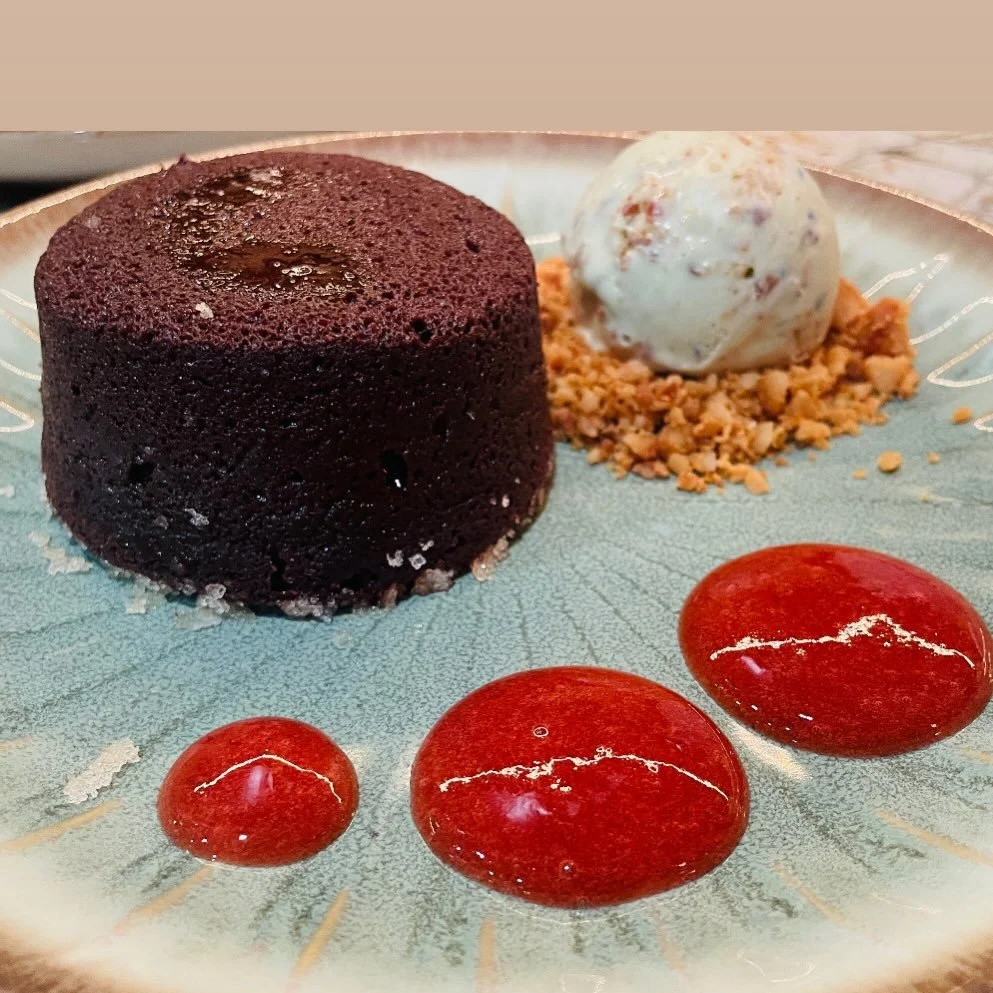 Molten chocolate lava cake with a warm, flowing center.
House-made vanilla bean &amp; butterfly pea flower ice cream, candied macadamia crunch, and a bright guava-strawberry coulis to finish.
#ChocolateLavaCake #MoltenChocolate #DessertLovers #Privat