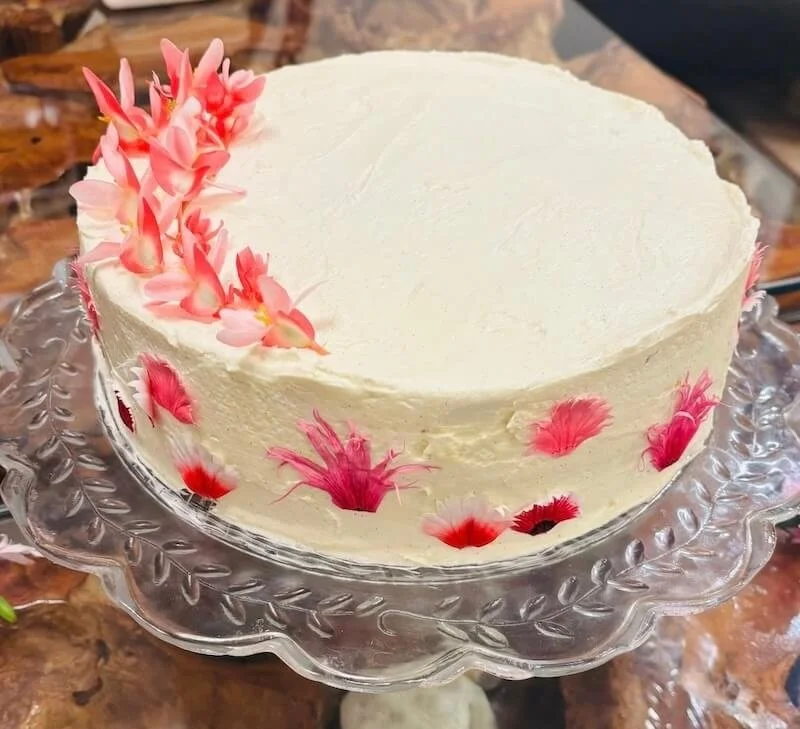 Vanilla cake with passion fruit curd and buttercream frosting.