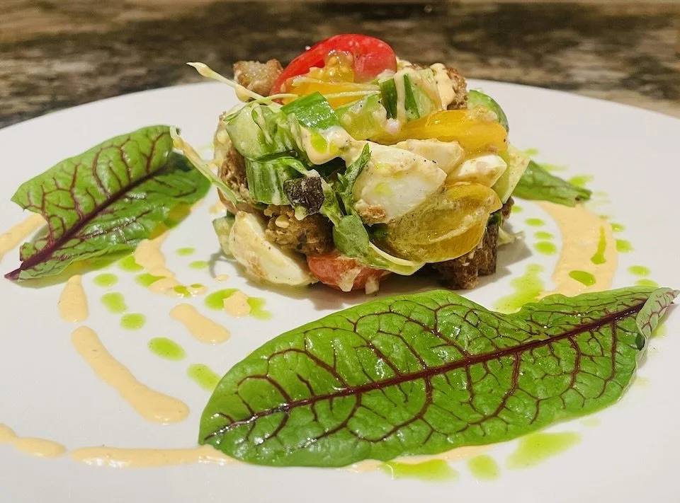Hawaiian panzanella salad with local Maui cherry tomatoes and Molokai sweet potato bread.
