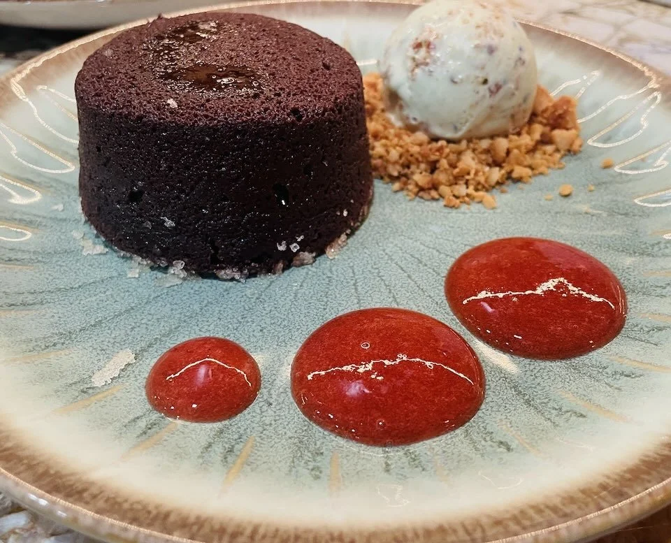 Hawaiian sea salted chocolate lava cake with vanilla bean ice cream and Maui guava coulis.