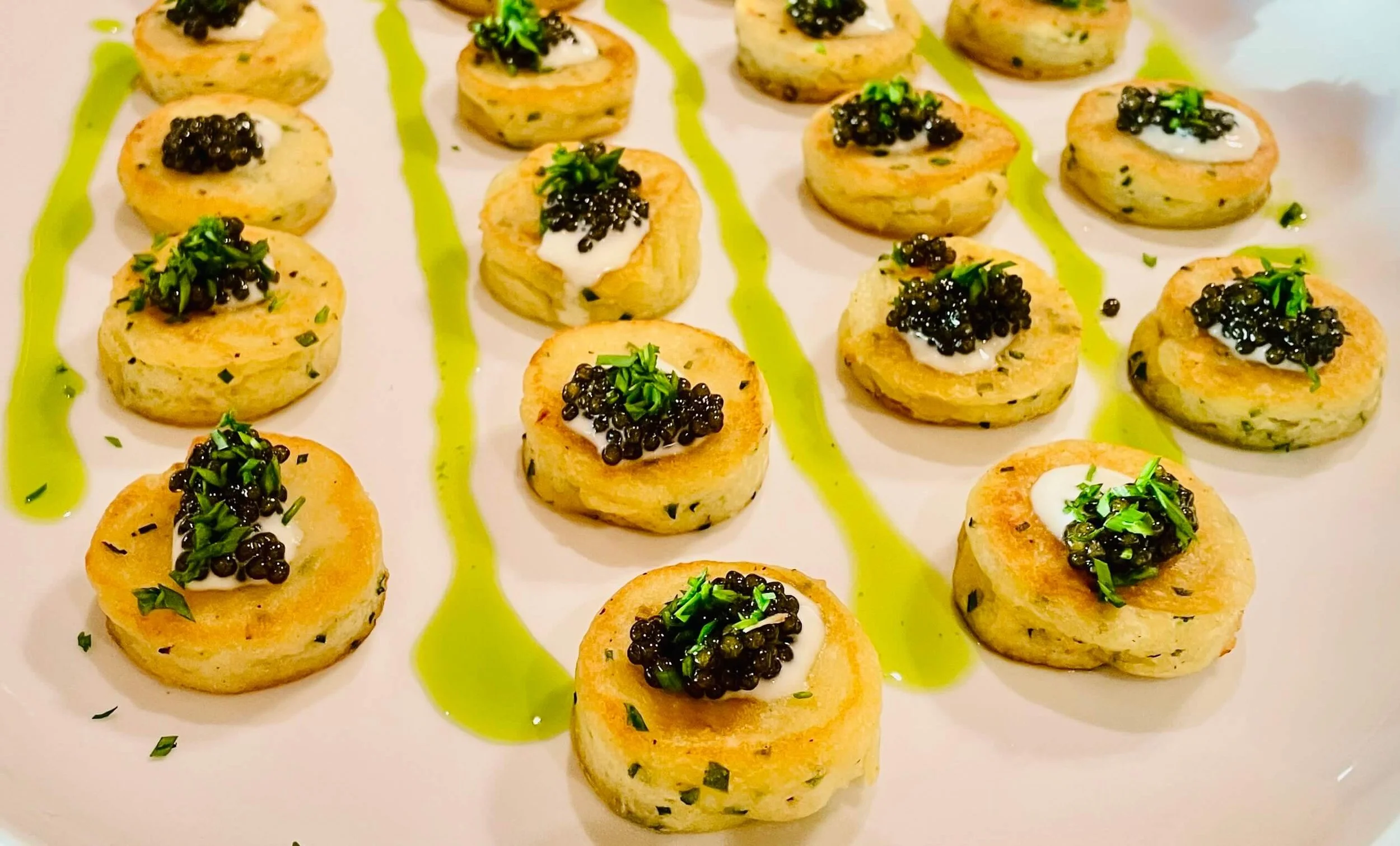 Caviar on potato cakes served during a Maui private chef dinner.