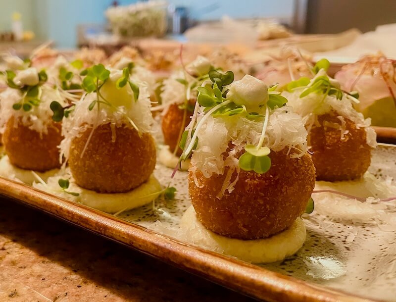 Wagyu beef croquette with crispy exterior and rich filling.
