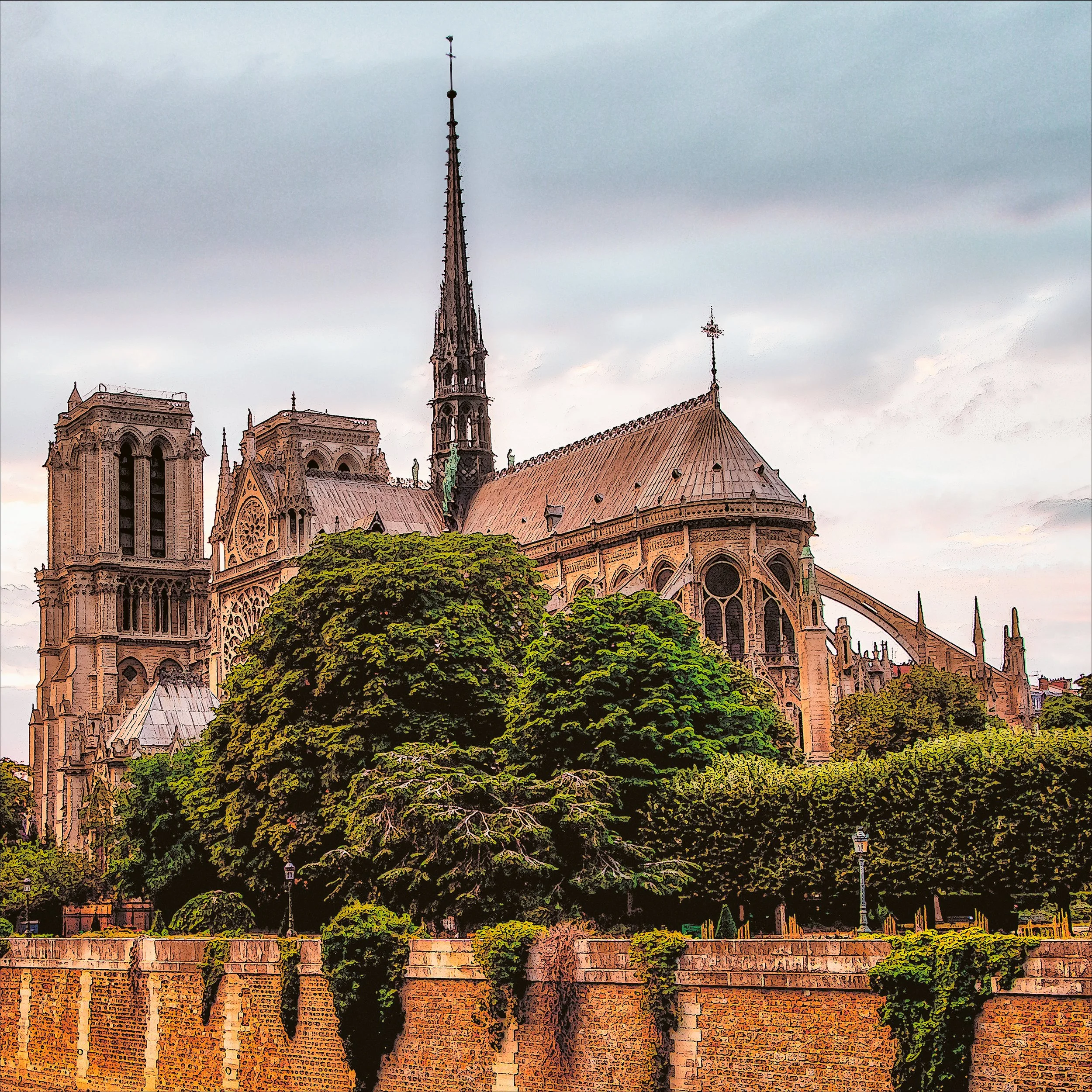 Notre-Dame Cathedral in Paris with trees and a stone wall in the foreground.