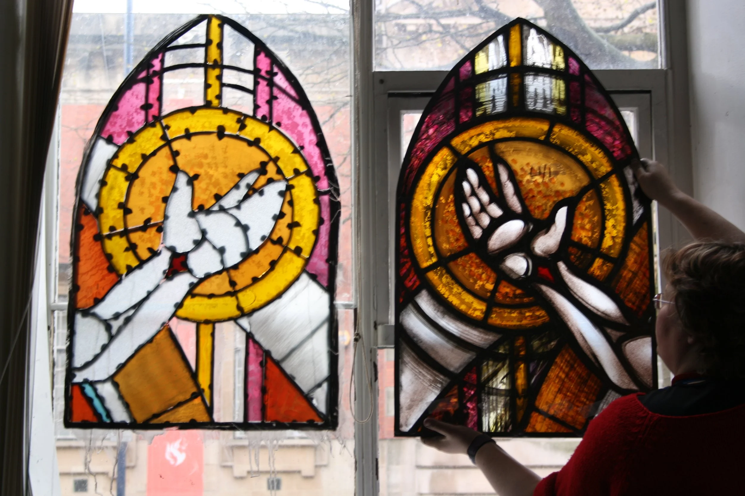 Rachel Phillips painting the Resurrection Window