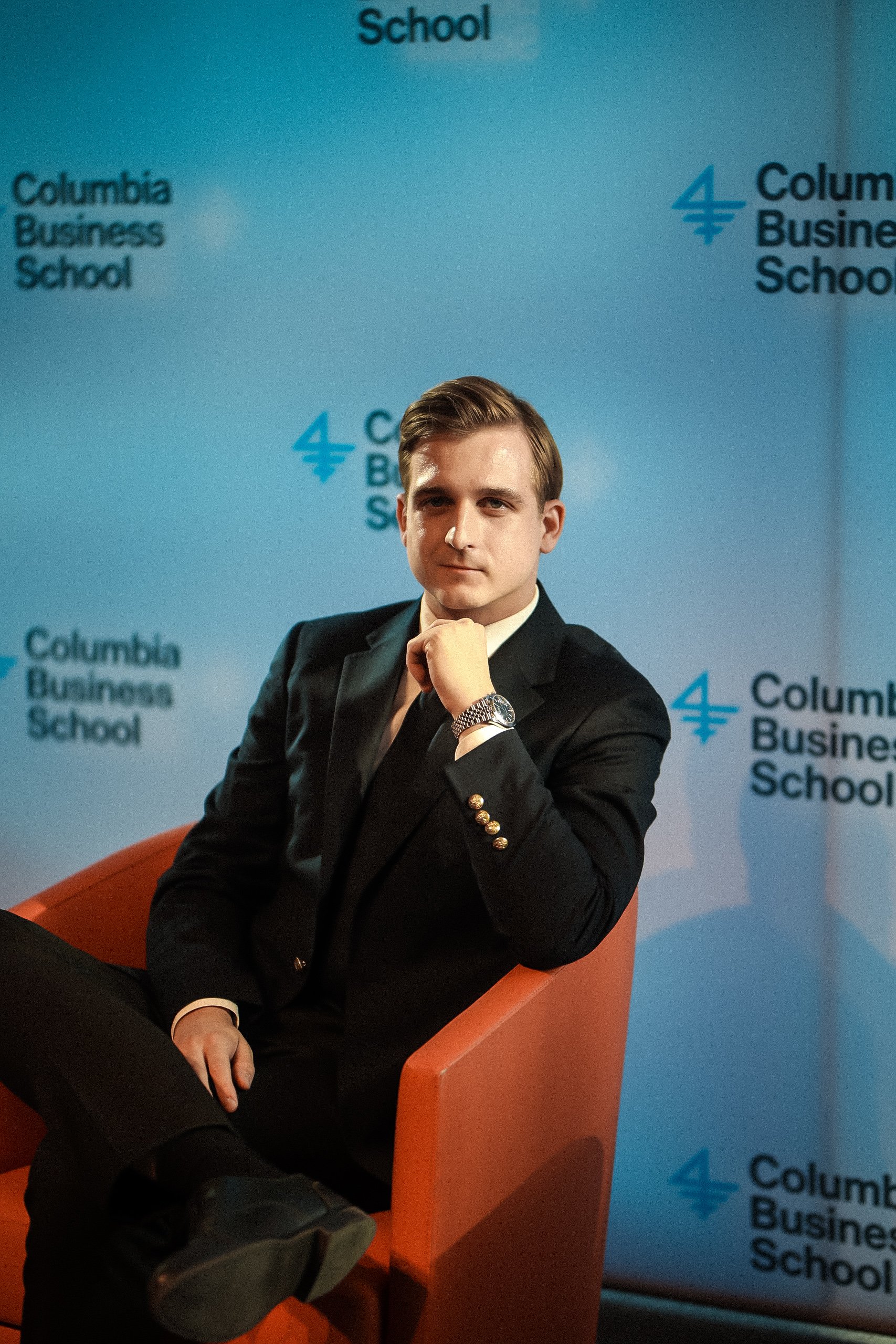 Tomasz Felpel, co-founder and investor, seated in a professional setting at Columbia Business School.