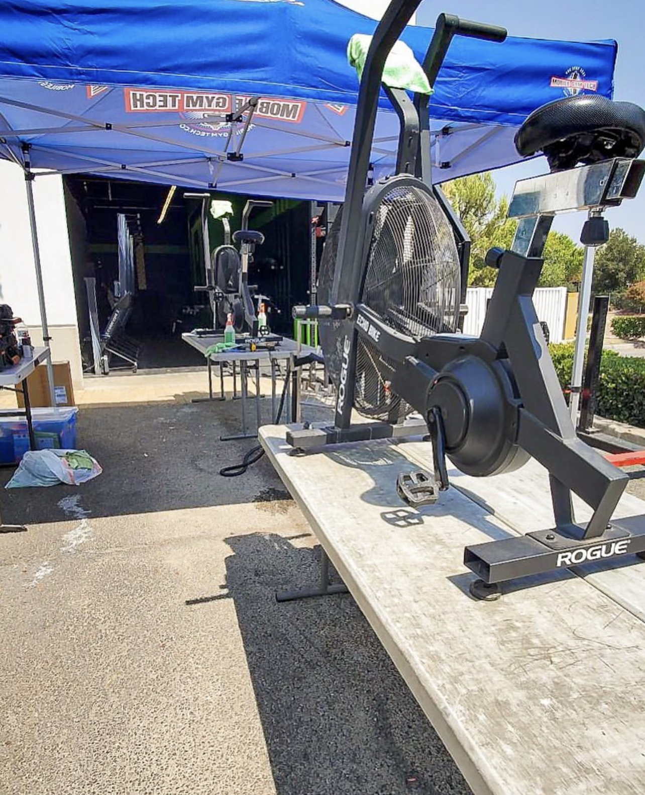 Gym maintenance on a Rogue Echo Bike stationary bike at a gym in Los Angeles