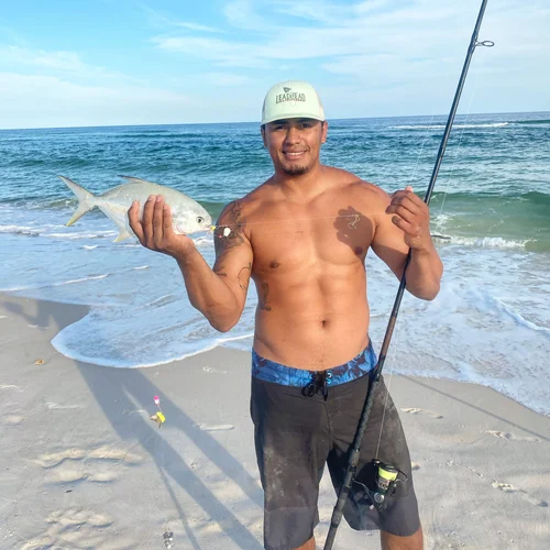 Charter fishing crew with a catch on a Pensacola beach