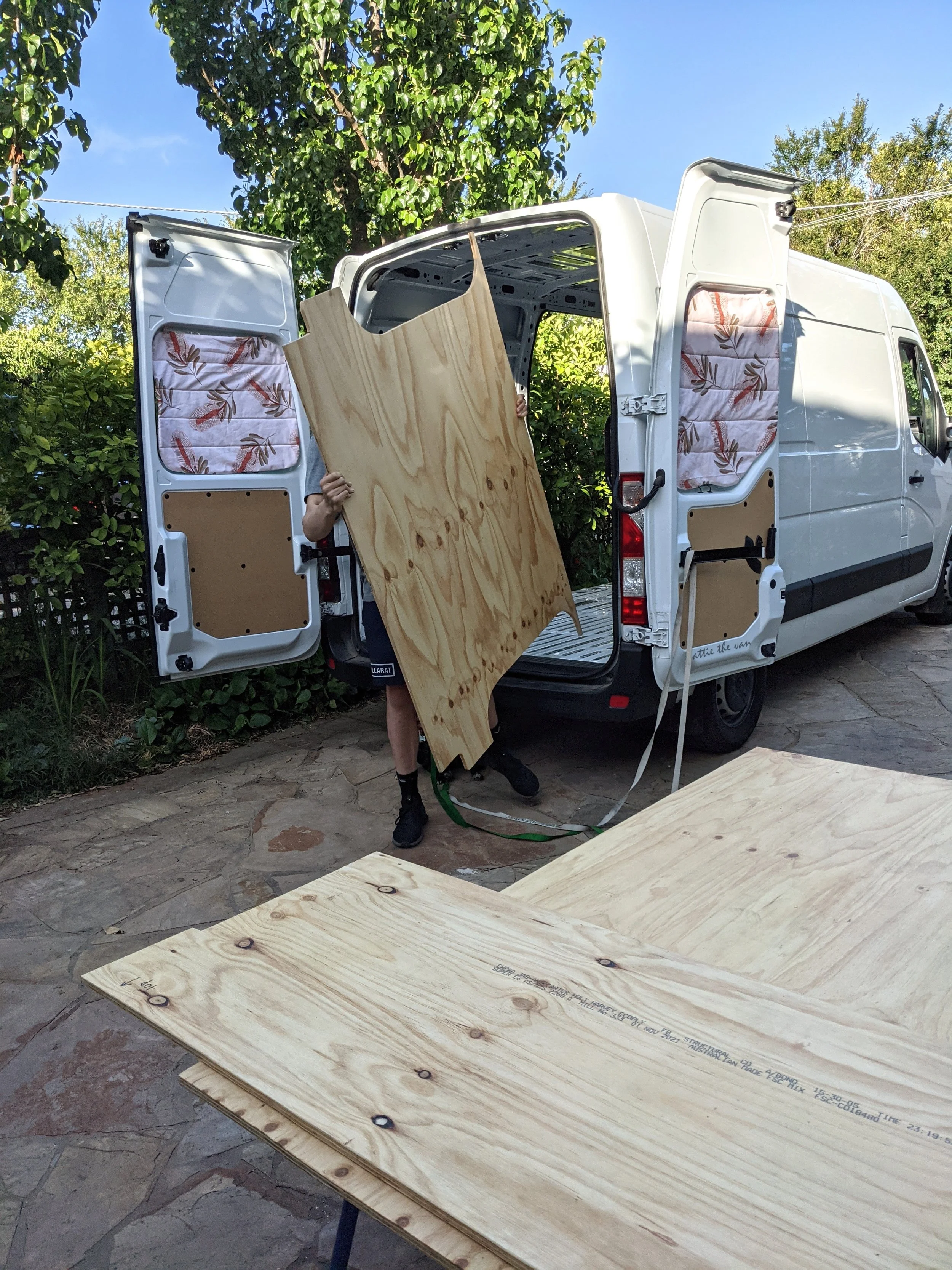 Van builder installing subfloor in van