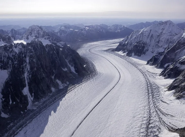 The Ruth Glacier winds its way down from the Alaska Range to the Chulitna River in the valley below.