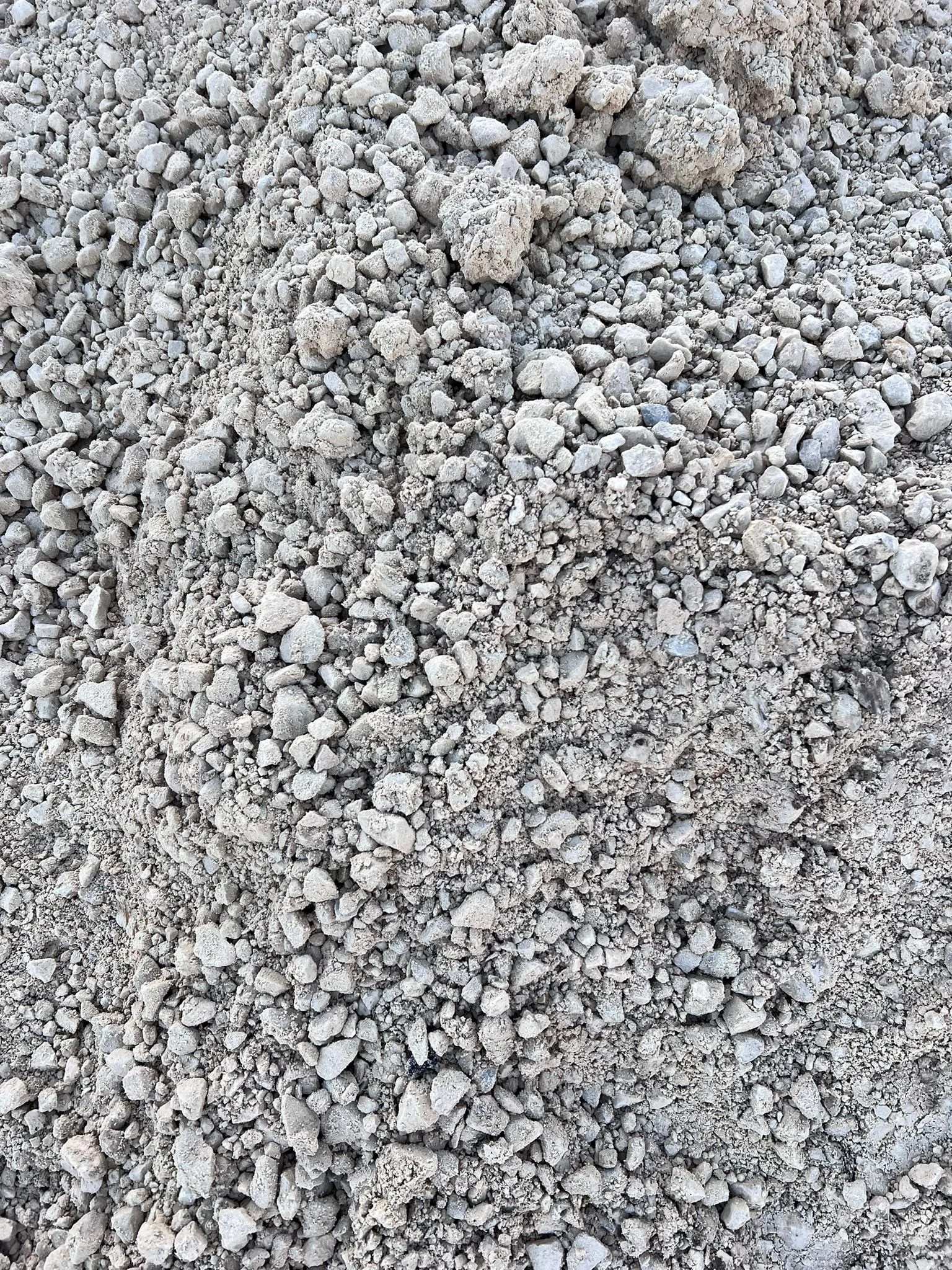 Loose gray gravel and small rocks stacked on the ground.
